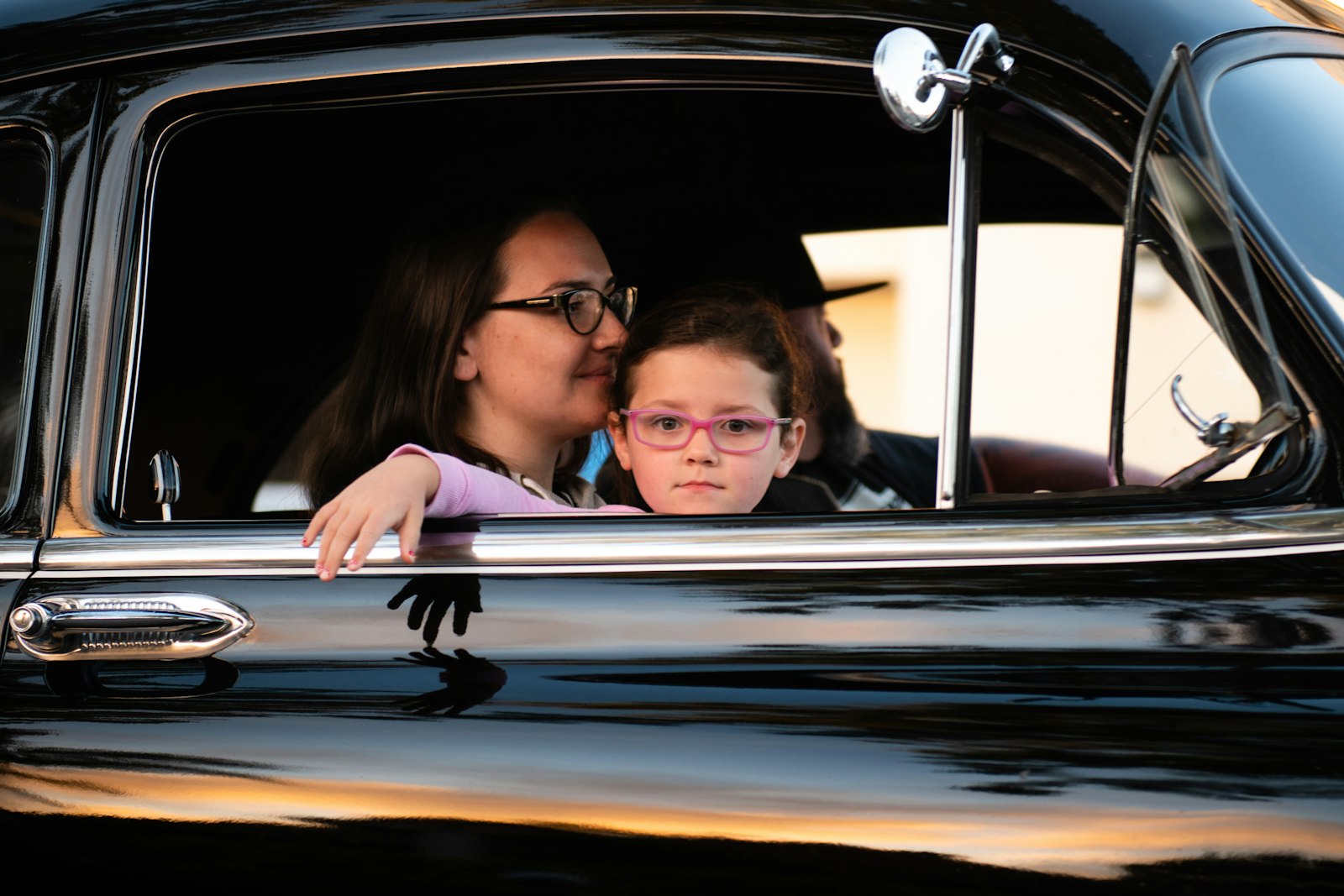Mother and child sitting together in a car