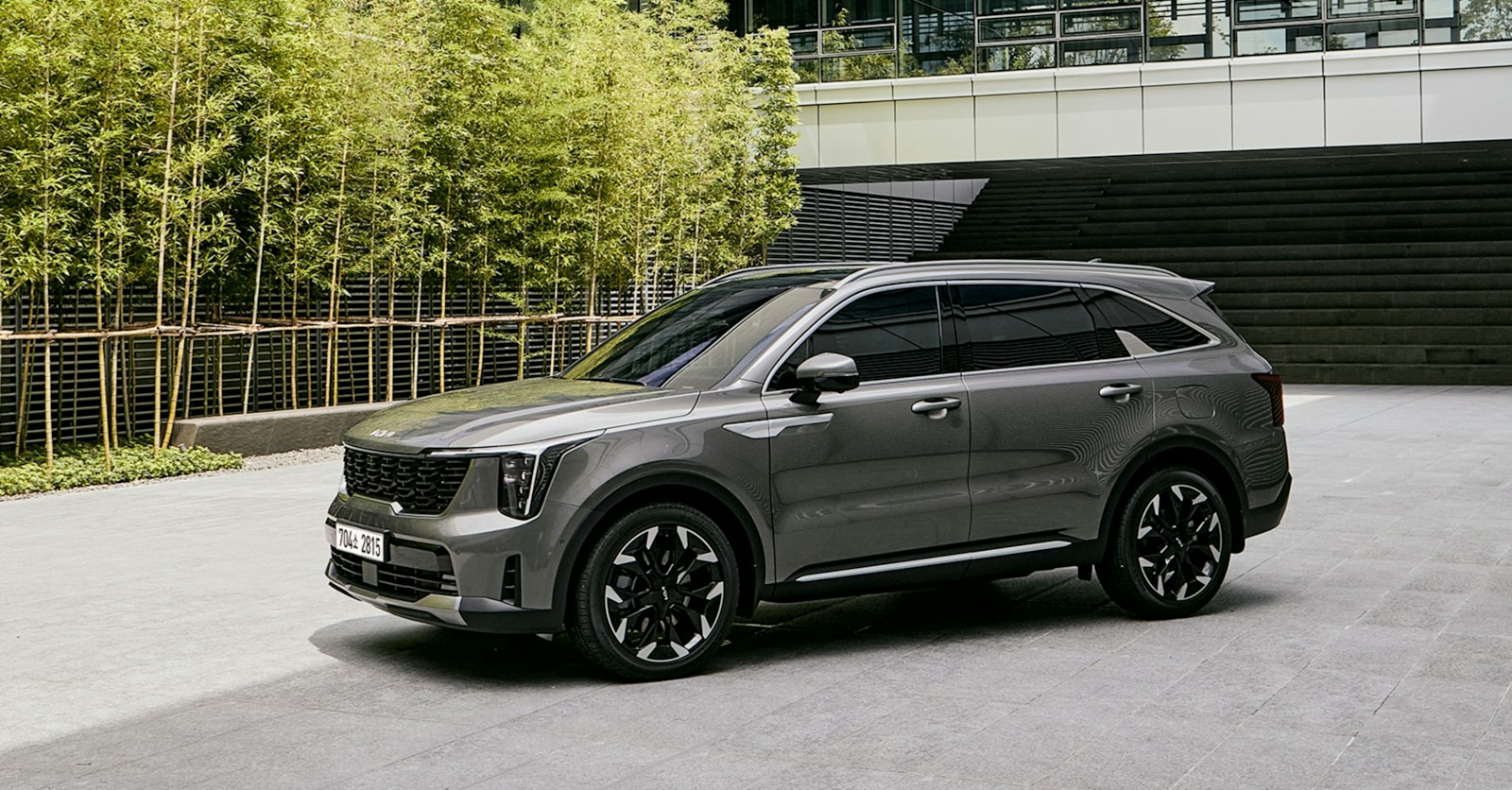Grey SUV parked in front of a building